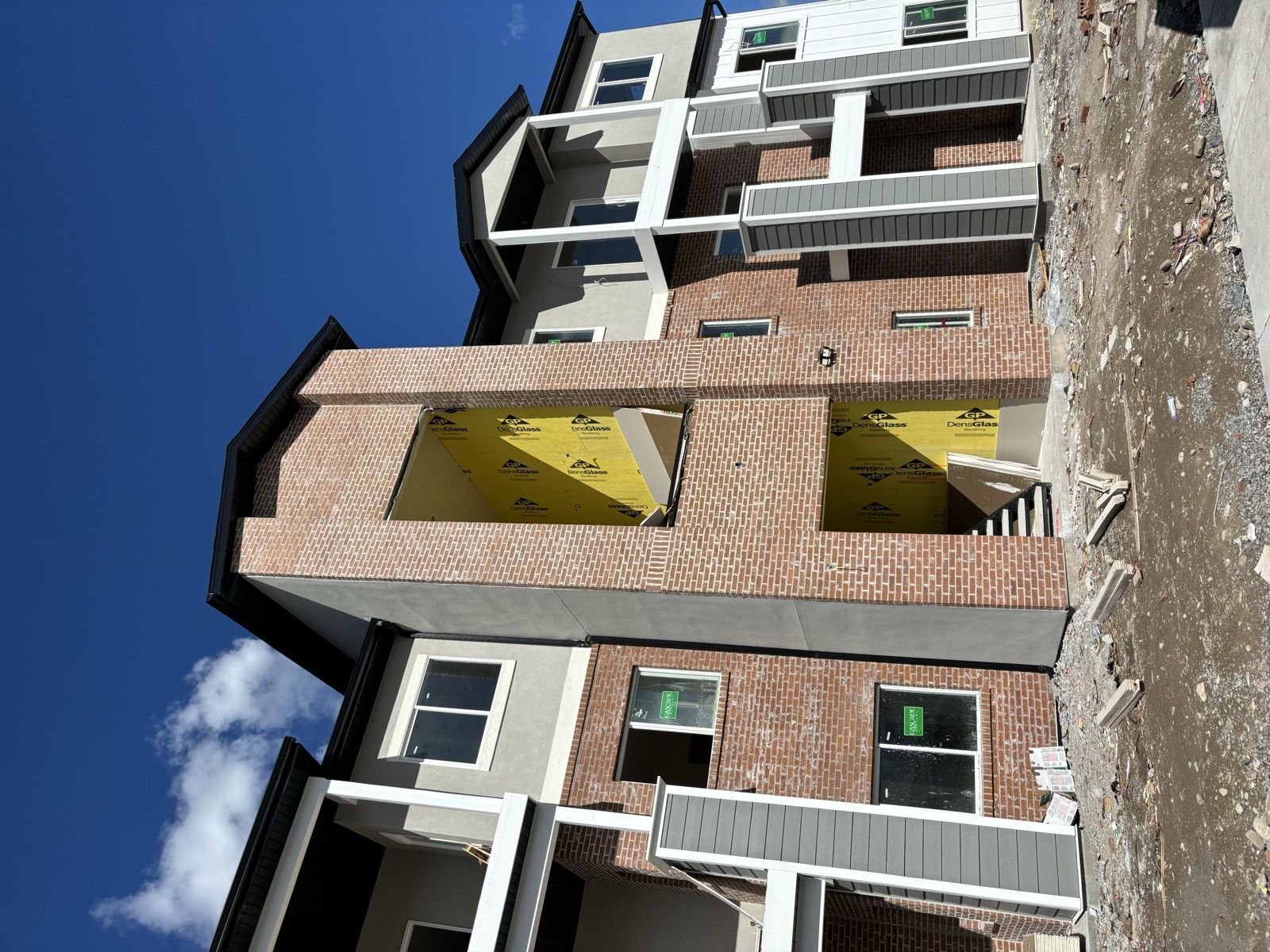Stone and stucco building facade by HWR Construction