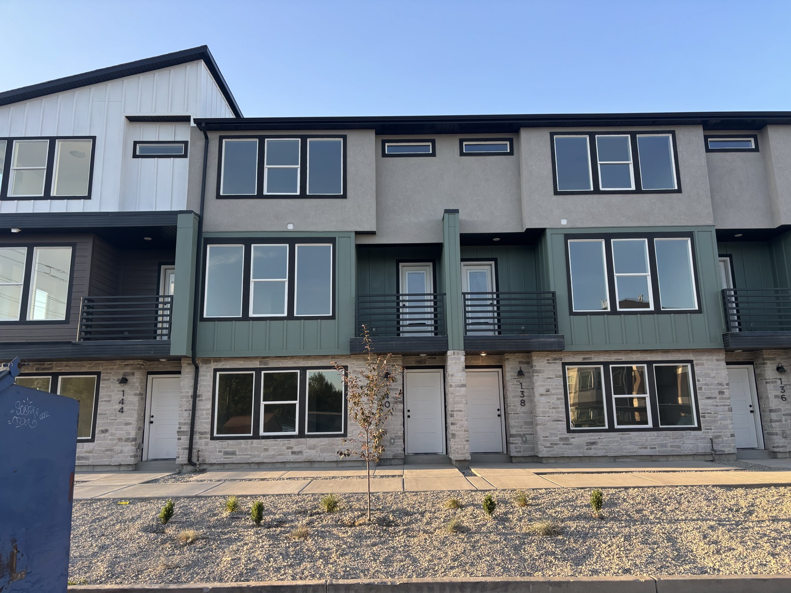 Row of finished townhomes by HWR Construction