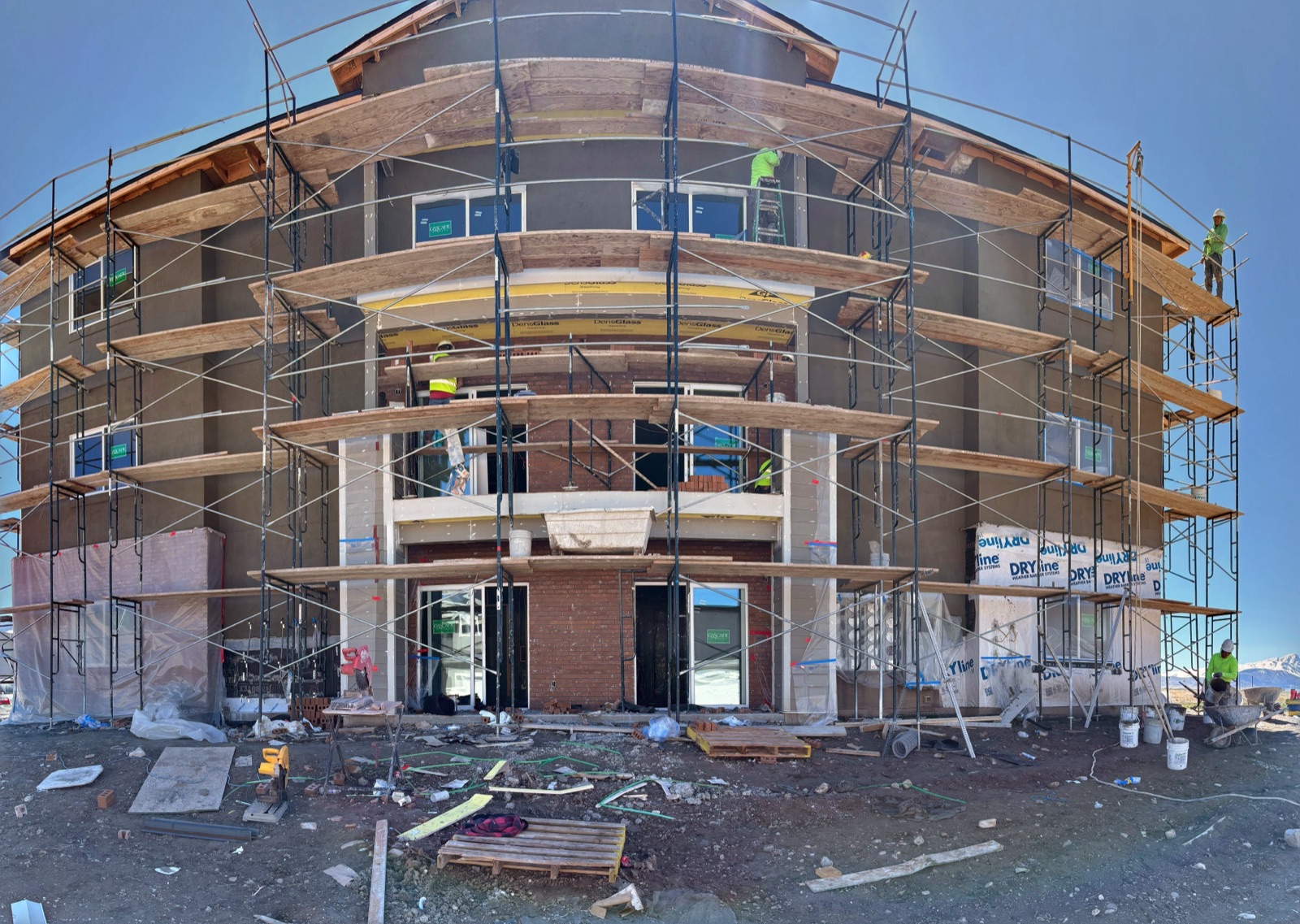 Multi-story building with curved facade under construction